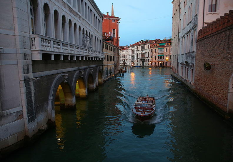 Scene from Venice, Italy.  Venice, the capital of northern Italy’s Veneto region, is built on more than 100 small islands in a lagoon in the Adriatic Sea. It has no roads, just canals – including the Grand Canal thoroughfare – lined with Renaissance and Gothic palaces.