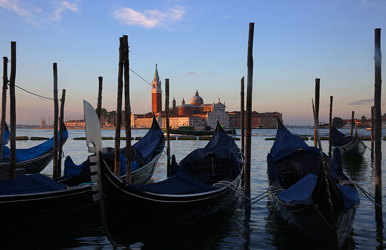 Scene from Venice, Italy.  Venice, the capital of northern Italy’s Veneto region, is built on more than 100 small islands in a lagoon in the Adriatic Sea. It has no roads, just canals – including the Grand Canal thoroughfare – lined with Renaissance and Gothic palaces.